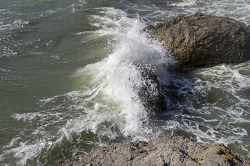 Strong surf breaking on coastal cliffs. Crimea.
