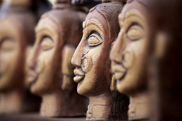 Hand crafted clay statues in a row
