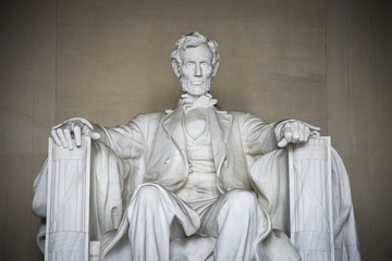 Fototapeta na wymiar Iconic statue of Abraham Lincoln, sculpted by Daniel Chester French, is in the Lincoln Memorial in Washington DC.