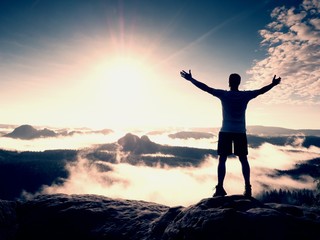 Fototapeta premium Happy man gesture raised arms. Funny hiker with raised hands
