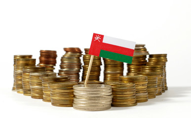 Oman flag waving with stack of money coins