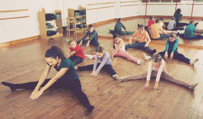 children with trainer stretching