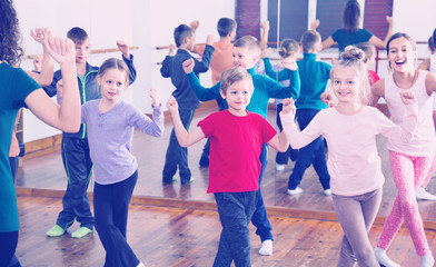 Children dancing contemp in studio smiling and having fun