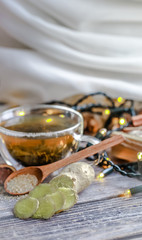 still life with transparent Cup of tea on wooden background