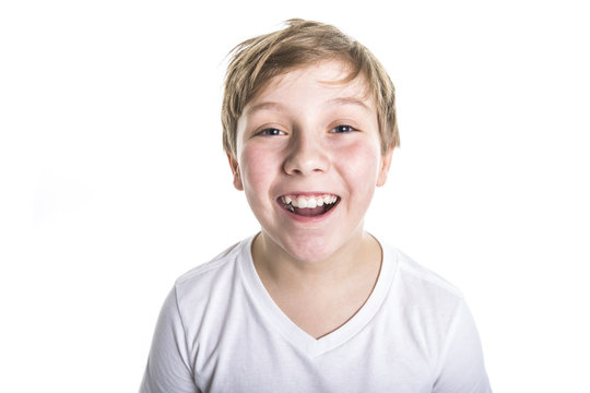 portrait of child. funny little boy on studio white background