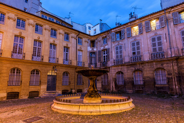 A fountain in Aix-en-Provence, France on a spring evening. 