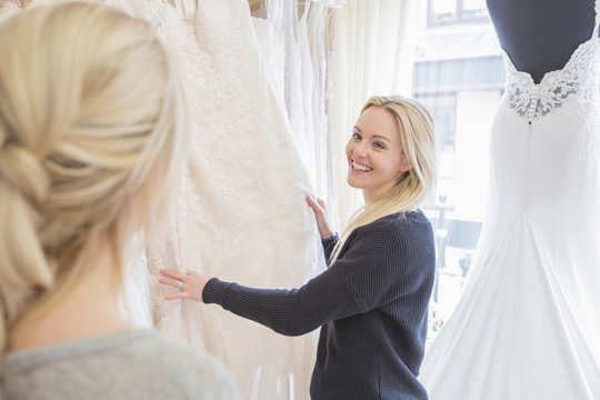 Female customer in bridal shop looking for wedding dress