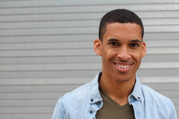 Obraz premium Happy Mixed Race Male Smiling Portrait with Copy Space