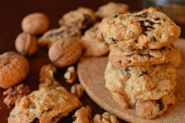 Homemade oat-nut-chocolate cookies with walnuts in shell
