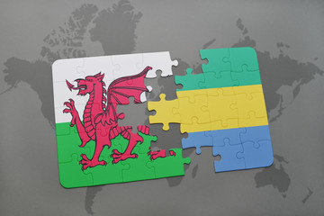 puzzle with the national flag of wales and gabon on a world map