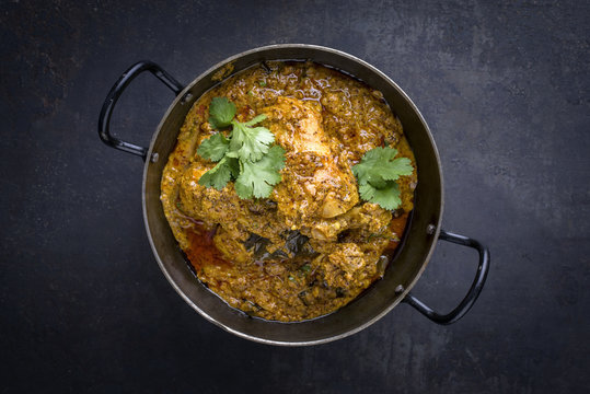 Traditional Indian Chicken Tikka Masala as top view in Bowl