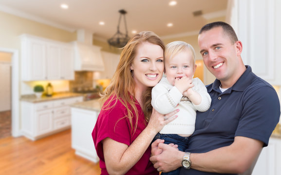 Happy Young Military Family Inside Their Beautiful Kitchen.