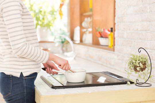 young asian woman in the kitchen