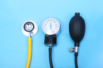 Stethoscope and medical equipmenton on blue background