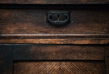 Texture of old wood. Retractable drawer sideboard closeup.