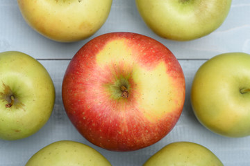 Green red apples on vintage background