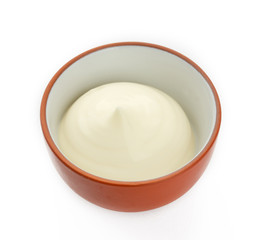 Mayonnaise in bowl isolated on white background