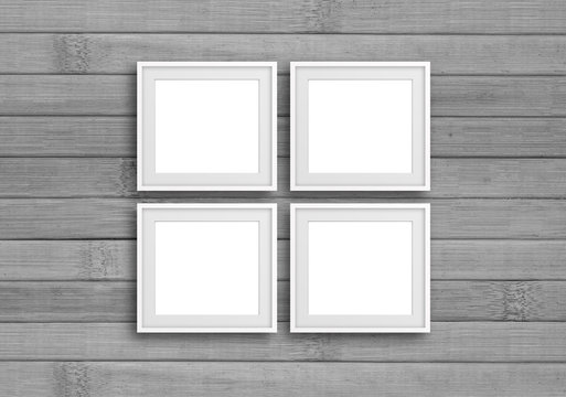 White frames on grey wooden panels wall. Interior decor background, gallery style mock up	