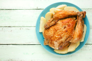 Roasted whole chicken with potatoes