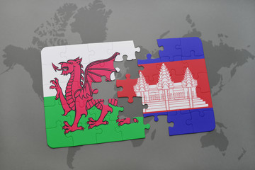 puzzle with the national flag of wales and cambodia on a world map