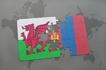 puzzle with the national flag of wales and mongolia on a world map
