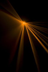 Laser beam orange on a black background