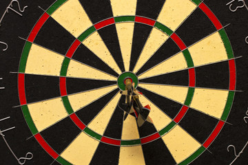 Dart arrows hitting in the target center