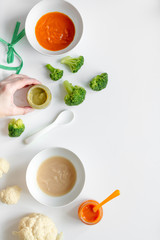cooking vegetable puree for baby on white background top view