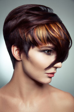 Fashion portrait of a beautiful girl with colored dyed hair, professional short hair coloring. studio shot.