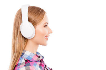 Side view of happy pretty blonde woman  in headphones