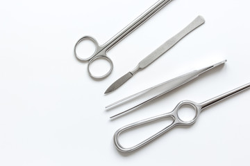 instruments for cosmetic surgery on white background top view