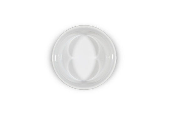 Small white deep bowl on white background from above