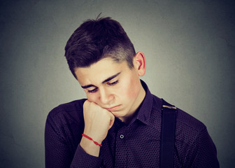 stressed sad man looking down