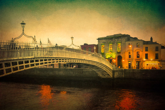 Vintage textured image of Dublin Ireland at Ha'penny bridge over the River Liffey  