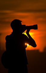 Photographer at sunset