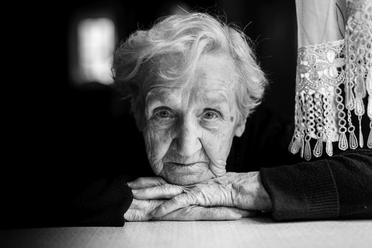 Grandma. Closeup black and white portrait of an elderly woman.
