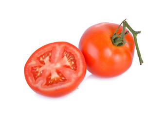 whole and half cut fresh tomato on white background