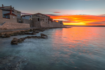 Naklejka premium Morning by the sea by the city wall in Novigrad, Croatia