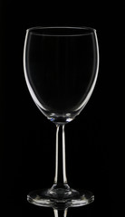 Elegant tall wine glass isolated on black background 