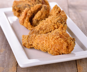fried chicken on wooden table