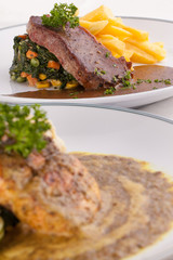 A nice dish beef and salmon steak served with mashed potato,lemon, saute spinach and sauce on wood background