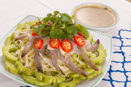 A Thai style dish of raw sea prawn served with cabbage and bitter cucumber and mint in spicy sauce.