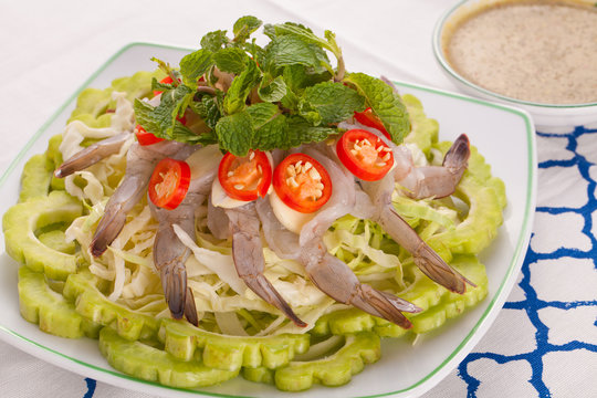 A Thai style dish of raw sea prawn served with cabbage and bitter cucumber and mint in spicy sauce.