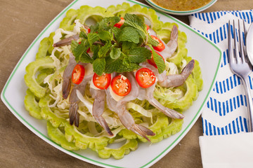 A Thai style dish of raw sea prawn served with cabbage and bitter cucumber and mint in spicy sauce.