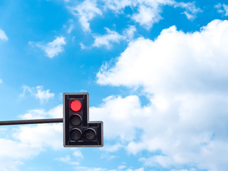 Green color on the traffic light with a beautiful blue sky in ba
