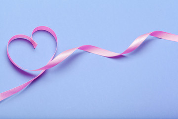 ribbon HIV, AIDS on blue background