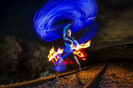 Man surrounded by fire and light