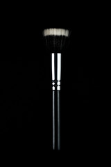 Makeup brushes on black background