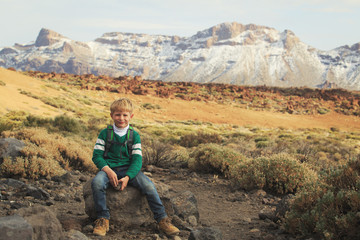 Fototapeta premium happy little boy hiking in mountains