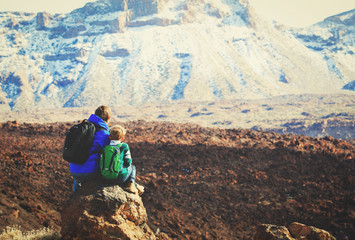Fototapeta premium father and son hiking in mountains